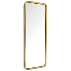 a gold framed mirror against a white wall