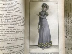 an open book with a drawing of a woman in a dress