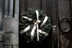 a wreath on the front door of a building