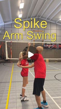 a man and woman in red shirts standing on top of a basketball court with the words spike arm swing