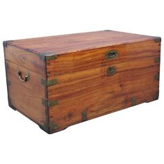 an old wooden chest with metal handles