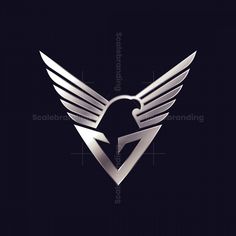 an image of a silver logo with wings on it's back side and the word,