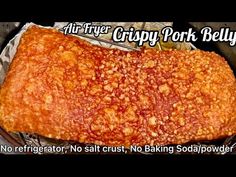 there is a large piece of food in the pan on the stove top with words above it that read, fire crispy pork belly no refrigerator, s salt, no crust, no baking