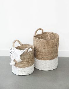 two woven baskets with handles and handles, one is brown and the other is white