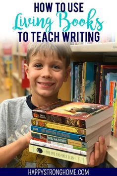 a young boy holding a stack of books with the title how to use living books to teach