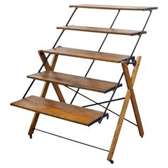 three tiered wooden shelf with metal legs