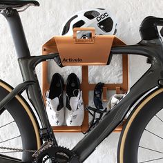 two pairs of shoes are placed on the back of a bicycle rack with other bicycles in it