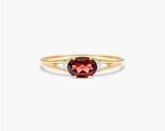 14K Yellow Gold Oval Garnet and Diamond Accent Birthstone Ring. The birthstone of January, Garnets are known for their captivating deep color. Garnets are said to bring love, luck, health, protection and friendship to those who wear it. This garnet ring with accent diamonds is the perfect piece for your special someone Oval Birthstone Promise Ring With Gemstone, Heirloom Oval Gemstone Birthstone Ring, Heirloom Oval Birthstone Ring With Gemstone, Heirloom Oval Birthstone Ring, Heirloom Garnet Oval Birthstone Ring, Oval Garnet Birthstone Ring, Oval Yellow Gold Birthstone Ring With Gemstone Accents, Oval Birthstone Ring With Gemstone Accents, Oval Birthstone Ring With Gemstone Accents In 14k Gold