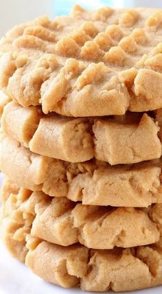 a stack of cookies sitting on top of a white plate