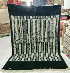 a black and white rug on display in a store