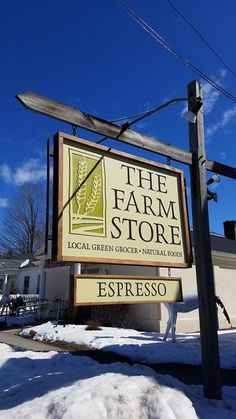 a sign for the farm store in winter