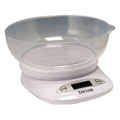 a scale with a bowl on top of it that is white and has the word taylor written