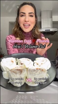 a woman holding a plate with food on it and the words dietian lost pounds how to volume eat