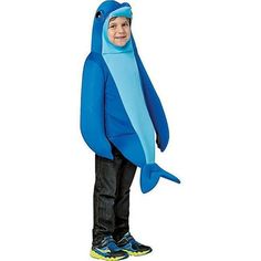 a young boy in a blue shark costume