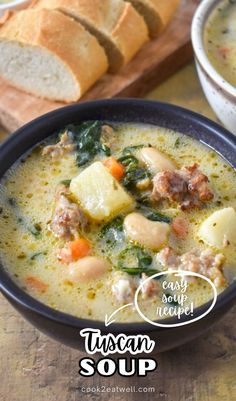 a bowl of soup with bread on the side