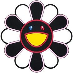 a black and white flower with blue eyes on it's center, surrounded by smaller circles