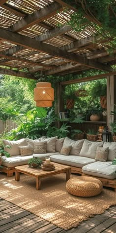 an outdoor living area with couches and tables