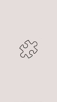 a black and white puzzle piece on a gray background