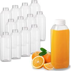 a bunch of bottles with oranges next to them