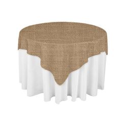 a round table covered with a burlocked linen cover and white ruffles