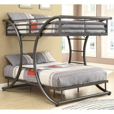 a metal bunk bed with two sets of mattresses on the bottom and one side