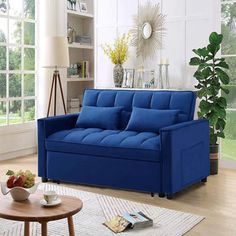 a living room with a blue couch and coffee table