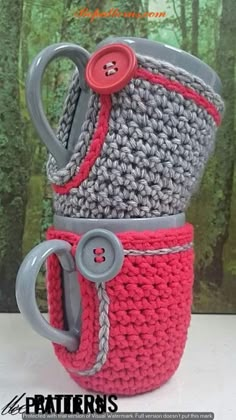 crocheted coffee cup holder with buttons and handles in red, gray and white