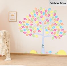 a child's room with a tree painted on the wall and a rug in front of it