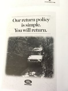 an advertisement for the ford motor company showing a car driving down a road with trees in the background