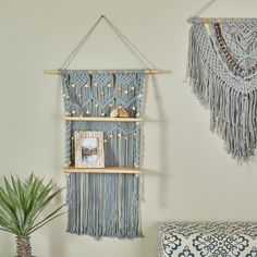 Maintain an organized home to create comfort and a welcoming atmosphere. Utilize your wall space to add more storage for a space saving solution in any compact area. Give your wall a charming appeal with this macrame inspired shelf and display your precious crystals, LED candles, and miniature potted plants. This item ships in 1 carton. Due to the handmade nature of this item, no two will be alike, there will be slight differences in shape, size, and color. Wall shelf comes with a hanging string Macrame Wood, Macrame Designs, An Organized Home, Macrame Shelf, Shelves Wood, Organized Home, Wall Shelf Decor, Wall Shelves Design, Color Wall