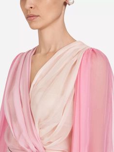 This Two-Tone Chiffon Blouse from Dolce & Gabbana is made of lightweight silk, providing a breathable, comfortable fit. Its crossed closure creates sensual finish, while delicate degradé pink nuances add romantic touch. Enjoy effortless style all day long with sophisticated piece. Spring Evening Silk Chiffon Blouse, Feminine Silk Chiffon Blouse For Spring, Feminine Silk Chiffon Blouse For Summer, Silk Chiffon Tops For Evening, Elegant Summer Georgette Blouse, Elegant Pink Blouse With Sheer Sleeves, Elegant Pink Chiffon Top, Sheer Silk V-neck Top, Silk Draped Blouse