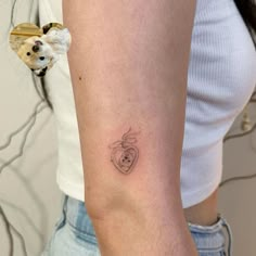 a woman with a small tattoo on her arm