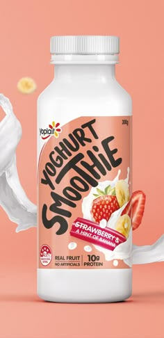 a bottle of yogurt smoothie on a pink background