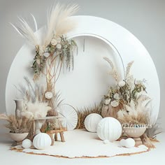 an arrangement of flowers and plants on display in front of a white wall with a circular background