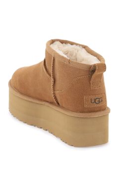 UGG Classic Ultra Mini boots crafted in stain and water resistant suede leather with raised stitching, UGGplush lining, leather patch with debossed logo applied on the heel and rear loop. SugarSole platform rubber sole. Composition: 100% leather Ultra Mini Boots, Mini Boots, Ugg Classic Ultra Mini, Zegna Shoes, Latest Fashion Design, Sheepskin Boots, Saint Laurent Shoes, Ugg Classic, Platform Ankle Boots