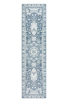 a blue and white runner rug with an ornate design