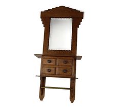 an antique wooden dresser with mirror on it's top and drawer below the mirror