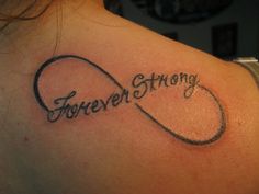 a woman's back shoulder with the words forever and an infinite sign on it