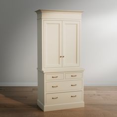 a white armoire sitting on top of a hard wood floor next to a wall