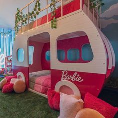 a room with bunk beds made to look like an airplane or boat in the grass