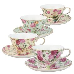 four tea cups and saucers with flowers on them