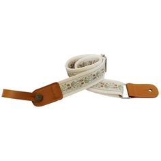 a white and brown leash with floral design on the side, one end has a leather buckle