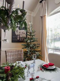 a dining room table with christmas decorations on it