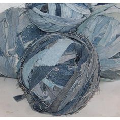 several pieces of blue jean fabric sitting on top of each other