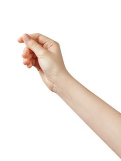 a person's hand holding something in the air with one arm extended and two fingers out