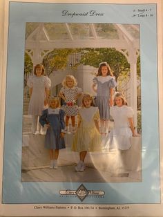 a group of children standing next to each other in front of a white gazebo