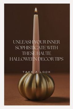 a candle sitting on top of a table next to a quote about halloween decorating