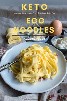 the cover of keto egg noodles on a white plate next to eggs and other ingredients