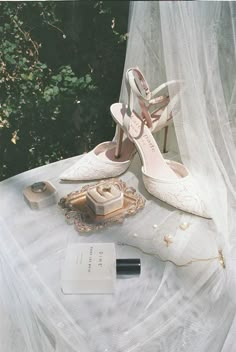 a pair of white shoes sitting on top of a table