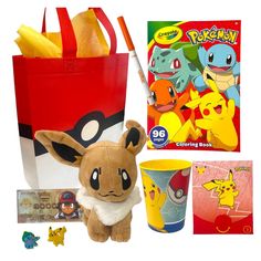 a stuffed animal sitting next to a red bag with pokemon stickers and other items